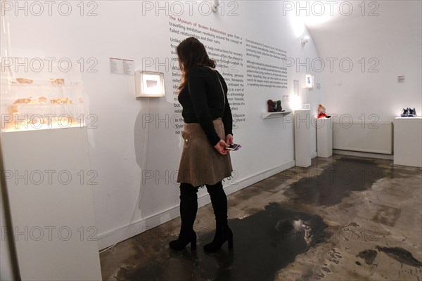 Museum of Broken Relationships: visitors watching the collection. Zagreb, Croatia