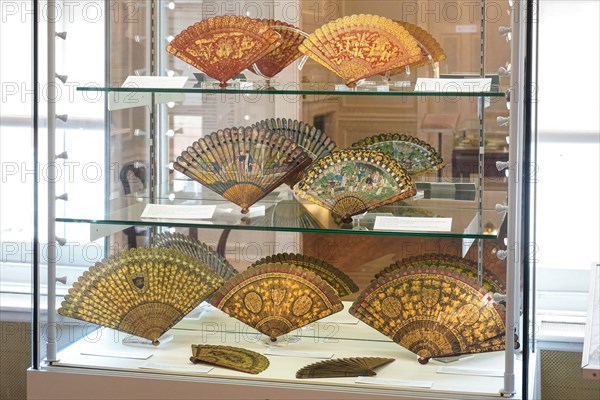 Hand fans on display in the Fan Museum in Greenwich, London England United Kingdom UK