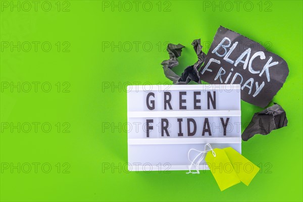 Green Friday concept with green sale and discounts tag, conscious and environmentally friendly shopping idea, useful things on sale instead of the usu