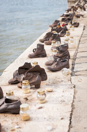 Budapest Hungary Holocaust memorial Jews Jewish people shot by Arrow Cross NAZI militia then thrown into River Danube candle