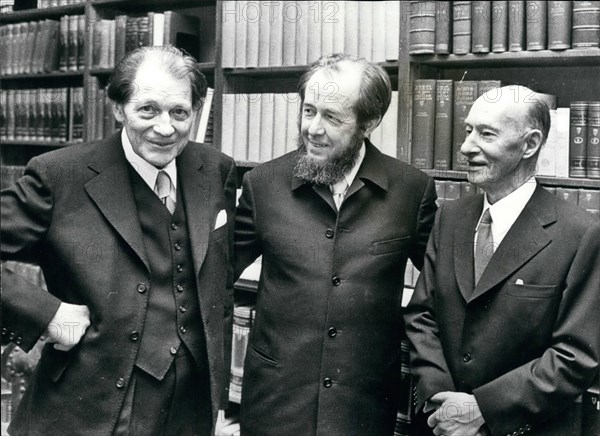 Dec. 12, 1974 - The Nobel Prize winners for Literature meet Solzhenitsyn at Stockholm cocktail party: The Nobel Prize winners were gathered together today when they attended a cocktail party held at the Stockholm Stock Exchange. The exiled Soviet Writer, Alexander Solzhenitsyn, was also present, and he will join the other winners at tomorrow's presentation ceremony when he will received his 1970 literature prize. Photo shows Alexander Solzhenitsyn (center) pictured with the two Swedish Noble literature prize winners, Harry Martinsson (left) and Eyvind Johnson, at today reception.