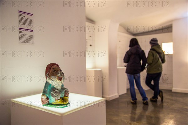 ZAGREB, CROATIA - 12 MARCH 2015: Tourists reading a love story in the Museum of Broken Relationships.