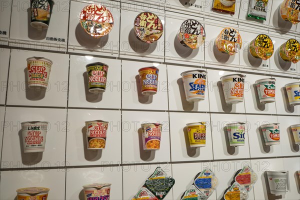 A wall showing some of Nissin's range of instant ramen products at the Instant Ramen Museum