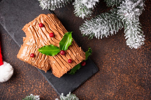 Christmas yule log cake. Traditional chocolate dessert