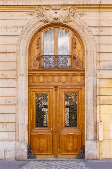 Paris, beautiful wooden door, typical window in the Marais