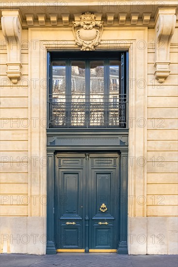 Paris, beautiful wooden door, typical window in the Marais