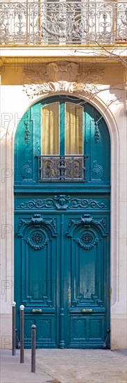 Paris, beautiful wooden door, typical window in the Marais