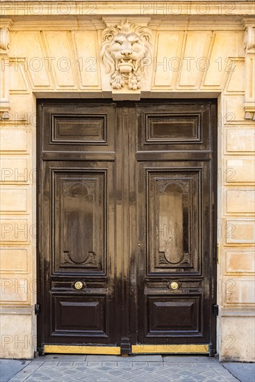 Paris, beautiful wooden door, typical window in the Marais