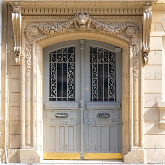 Paris, beautiful wooden door, typical window in the Marais