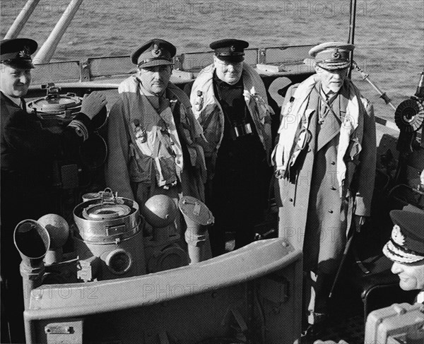 Churchill visiting the invasion beaches shortly after D-day.On his right Field Marshal Alan Brooke on left: Field Marshall Jan Smuts. 12th June 1944