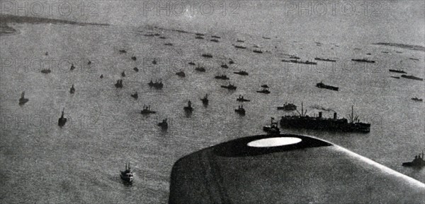 Black and white photograph of World War II (1939-1945) showing the aerial view of the Allied sea invasion of Normandy on D-Day, 6 June 1944.