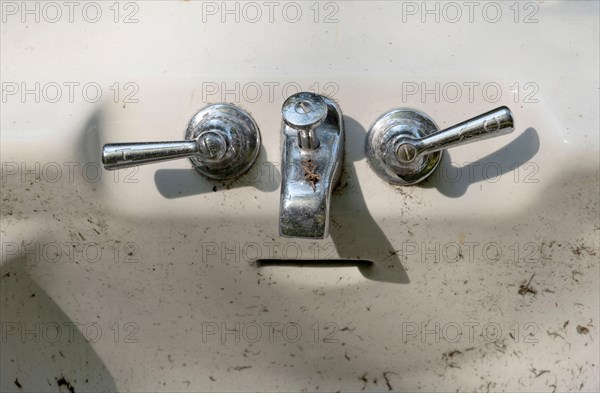 porcelain bathtub appears to have a face, with the handles being eyes, the faucet a nose and the over flow slit a mouth. a concept called pareidolia