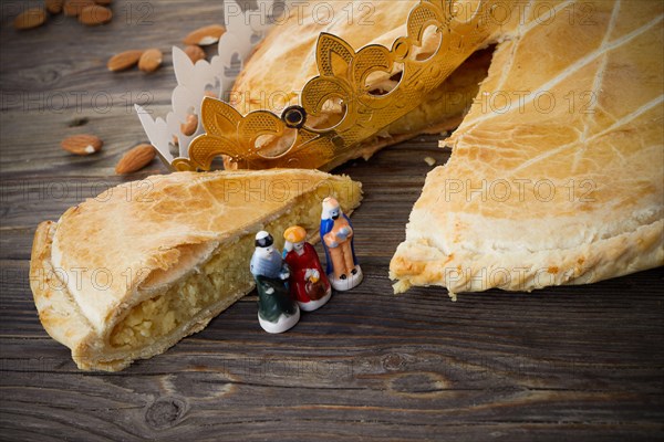 Epiphany cake, French Galette de rois with figure of three kings.