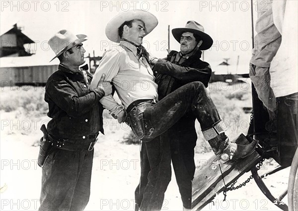 PALS OF THE SADDLE 1938 Republic Pictures film with John Wayne being hauled aboard a wagon