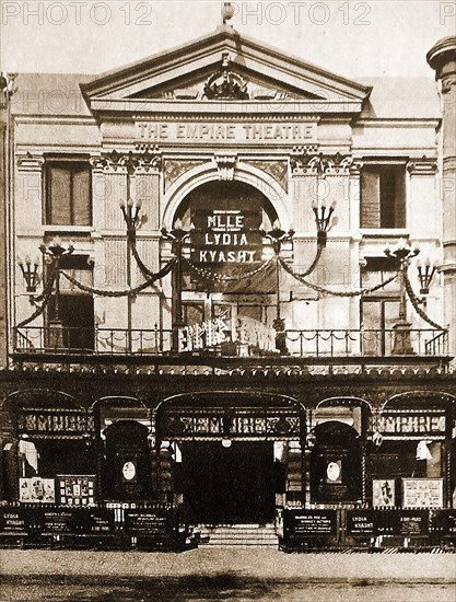 The former Empire Theatre, Edmonton, London, England just after its opening to the public  on 26th December 1908 as a 1,300 seat music hall theatre and part-time cinema by  Mae Rose Bawn  the ' My Fancy' or the  'Queen of sand dancers'. Designer was  Bertie Crewe. It was on this stage that  Marie Lloyd  collapsed on stage (1922)  and died  a few days later The American born Ballerina Lydia Kyasht (aka Kiaksht, Kyaksht) was top billing at the theatre when the photograph was taken. She she  succeeded  Adeline Genée as prima ballerina at the Empire Theatre until 1913.