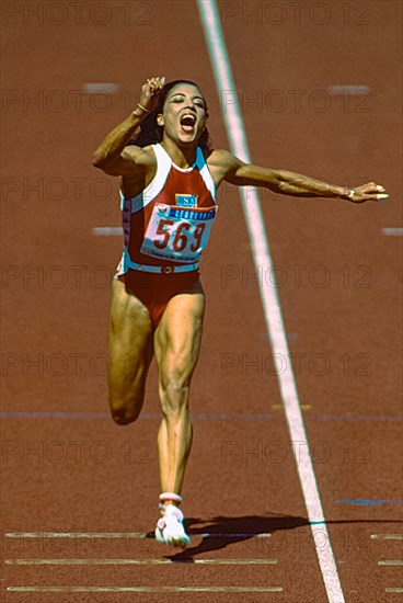 Florence Griffith Joyner (USA)  wins the gold medal in the Women's 100m Final at the 1988 Olympic Summer Games.