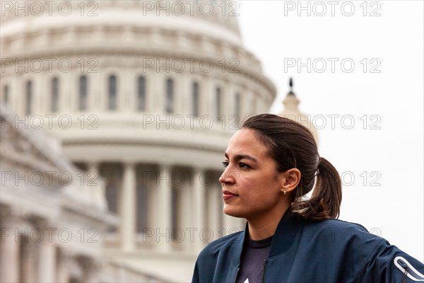 Congresswoman Alexandria Ocasio-Cortez (D-NY) listens as Congresswoman Cori Bush answers questions about her role in extending the pandemic eviction moratorium at a press conference announcing the new 60-day ban on evictions.