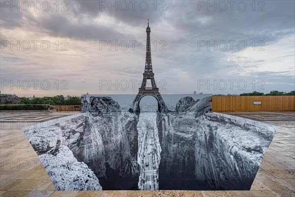 JR anamorphic artwork in front of the Eiffel Tower in Paris