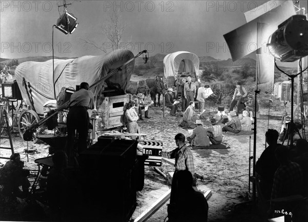 HELENA CARTER and RANDOLPH SCOTT on set candid with Camera / Movie Crew during filming of FORT WORTH 1951 director EDWIN L. MARIN writer John Twist cinematographer Sidney Hickox music David Buttolph Warner Bros.