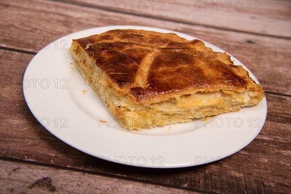 Pithiviers, Pastry dough Galette des Rois with cream frangipane with white overground almond