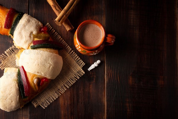 Traditional Kings day cake also called Rosca de Reyes, roscon, Epiphany Cake and with a clay Jarrito. Mexican tradition on January 5th