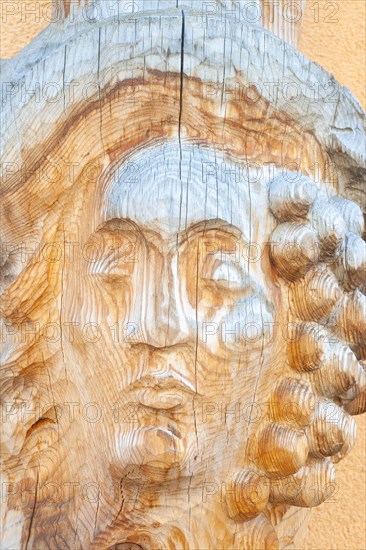 Man portrait carved on wood