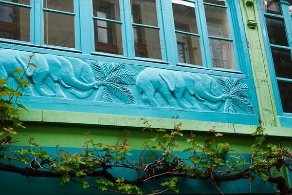 La Cité du Figuier, hidden street with colorful architectural detail, a place where mostly metal workers had shops during the 19th century, Paris.