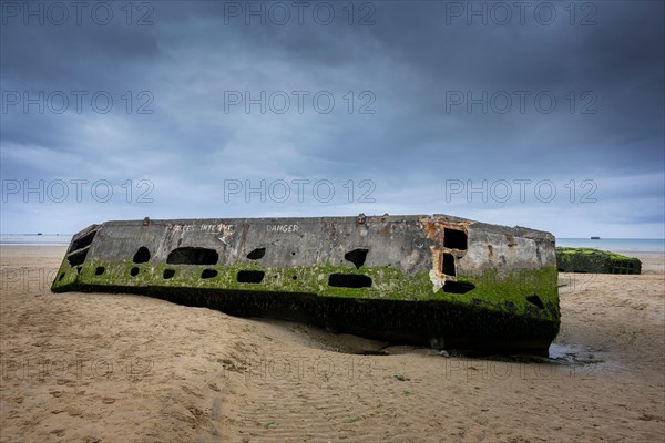 Remains of a Mulberry Harbour on the beach at Arromanches-les-Bains, Normandy, France.