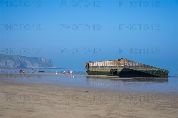 Remains of a Mulberry Harbour on the beach at Arromanches-les-Bains, Normandy, France.