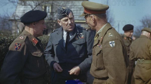 Preparations For 'operation Varsity', the Crossing of the Rhine, at Walbeck, Germany, 22 March 1945 The Commander of the 21st Army Group, Field Marshal Sir Bernard Montgomery (left), the Commander of the 2nd Tactical Air Force, Air Marshal Sir Arthur Coningham (centre) and the Commander of the British 2nd Army, Lieutenant General Sir Miles Dempsey, talking after a conference held in a small German village attended by all Senior Officers of the 21st Army Group and 2nd Tactical Air Force. At the conference Field Marshal Montgomery gave the order for the 2nd Army to begin the assault crossing of