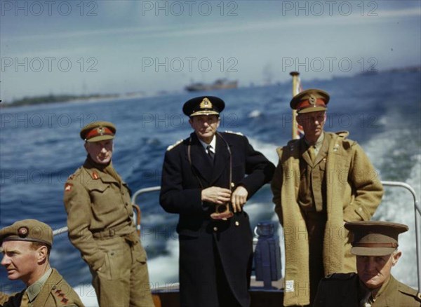 Kiel Harbour, Germany, 19 May 1945 The Commander of the 8th Army Corps, Lieutenant General E H Barker; the Flag Officer in Charge, Kiel Harbour, Rear Admiral H T Baillie-Grohman; and the Commander of the 2nd Army, Lieutenant General Sir Miles Dempsey on the Admiral's barge during a tour of Kiel Harbour.