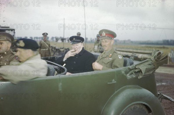 The Visit of the Prime Minister, Winston Churchill To Caen, Normandy, 22 July 1944 The Prime Minister, the Rt Hon Winston Churchill, MP, sitting in a staff car with the Commander of the British 2nd Army, Lieutenant General Sir Miles Dempsey. In the front seat is General Sir Bernard Montgomery, Commander of the 21st Army Group.