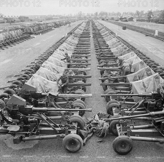 Preparations For Operation Overlord (the Normandy Landings)- D-day 6 June 1944 40mm Bofors Light AA guns on Mark II mountings lined up at an Ordnance Depot at Bicester.