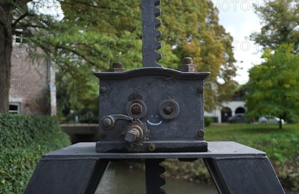 drawn on smiley face on an ancient bridge detail