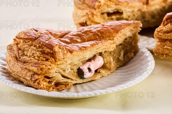 Epiphany cake on wooden table. Galette des rois traditional Epiphany cake in France.