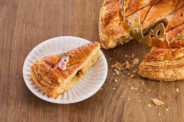 Galette des rois on wooden table.Traditional Epiphany cake in France.