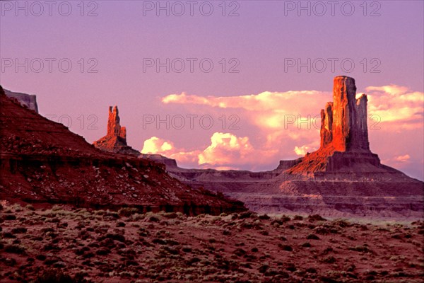 sunset over Monument Valley Tribal Park in the deserts of the American Southwest in Utah where western movies were filmed