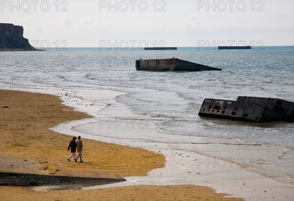 The Beach at Arromanches, Normandy with some of the remains of the Mulberry Harbour used in the 1944 Normandy Landings