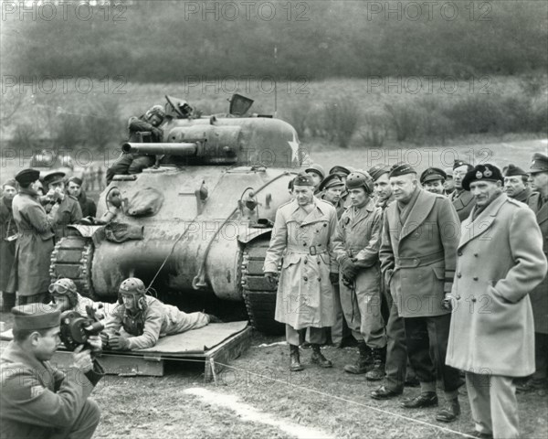 GENERALS EISENHOWER and Montgomery at right watching US troops exercising at Warminster on 28 February 1944