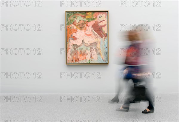 Visitors walk past the painting 'Flowers, Mary's Table' from 1971 by Willem de Kooning at the Pinakothek der Moderne in Munich, Germany, 29 March 2012. On the occasion of its 10th anniversary the Pinakothek der Moderne shows femininity from the point of view of three painters of the 20th century. The exhibition titled 'Women' opens on 29 March 2012 and runs till 15 July 2012. Photo