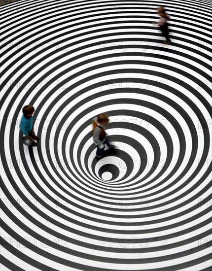 Three children play on the walkable disc 'Spazio ad Attivazione Cinetica' by the Italian artist Marina Appolonio at the entrance of the Schirn exhibition hall in Frankfurt, Germany, 16 February 2007. It features in the exhibition 'Op Art' that runs at the Schirn Frankfurt from 17 February to 20 May 2007. The 'Op Art' formed in the early sixites with a strong interest in scientific