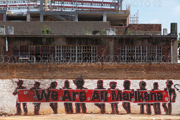 A mural that reads 'We are all Marikana' in reference to the shooting of 34 miners by police. Johannesburg. South Africa.