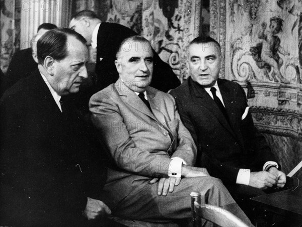 President Georges Pompidou talks with colleagues
