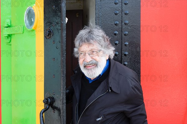 Liverpool, UK, 12th May 2014. Artist Carlos Cruz-Diez visits a freshly painted dazzle ship in Liverpool. In collaboration with the Liverpool Biennial he designed the paint scheme for the ship Edmund Gardner which is owned by National Museums Liverpool. The ship is part of the 2014 Liverpool Biennial. Credit:  Peter Carr/Alamy Live News