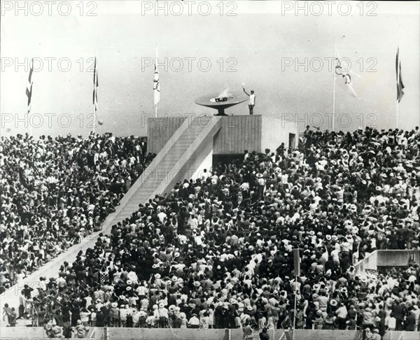 1968 - Opening of the Olympic Games Lighting the Flame: Photo Shows 20-year old Mexican athlete Enriqueta Basilio, is seen lighting the Olympic Flame Torch - the first woman in the history of modern Olympic games to do so - during the opening ceremony at the Olympic Stadium in Mexico City. © Keystone Pictures USA/ZUMAPRESS.com/Alamy Live News