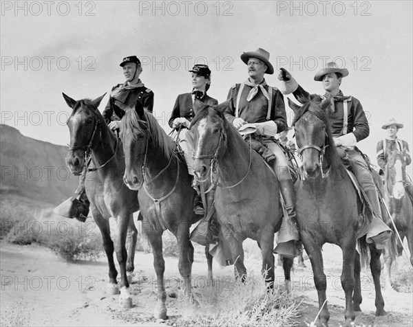 DER TEUFELSHAUPTMANN She wore a yellow ribbon USA 1949 / John Ford JOHN AGAR (Lt. Flint Cohill), JOANNE DRU (Olivia Dandridge), JOHN WAYNE (Capt. Brittlese), BEN JOHNSON (Sgt. Tyree) rights = RM Regie: John Ford aka. She wore a yellow ribbon