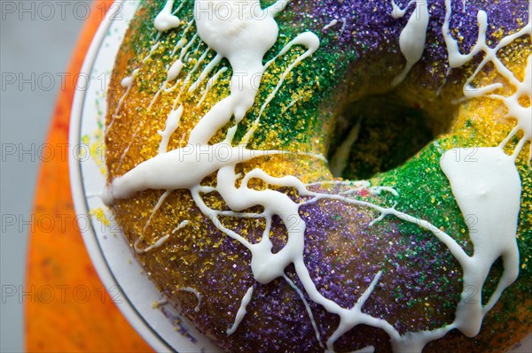 New Orleans king cake up close on a table.