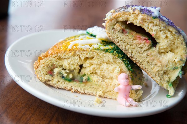 Plated slices of New Orleans king cake.