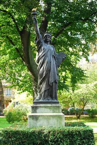 A minature version of the Statue of Liberty in the gardens of the Palace du Luxembourg in Paris, France