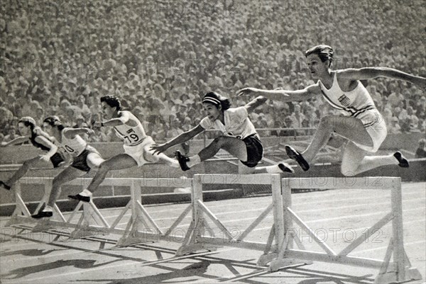 Photograph of Mildred Ella "Babe" Didrikson Zaharias (1911 - 1956)  winning the 80m Hurdles at the 1932 Olympic games. Babe gained world fame in track and field and All-American status in basketball.